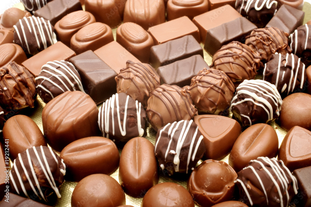 Fototapeta premium close up shot of chocolates on white background