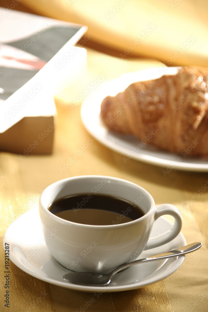 close up image of croissant and tea close up image of croissant and tea