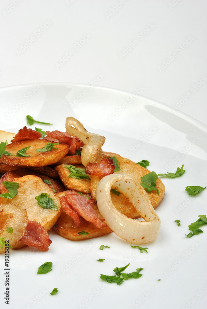 roasted potato with organic onion on a white plate roasted potato with organic onion on a white plate