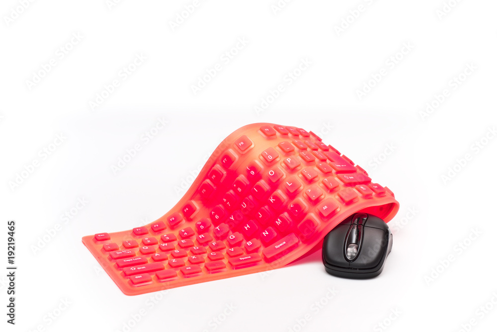 magenta flexible keyboard with black mouse isolated magenta flexible keyboard with black mouse isolated