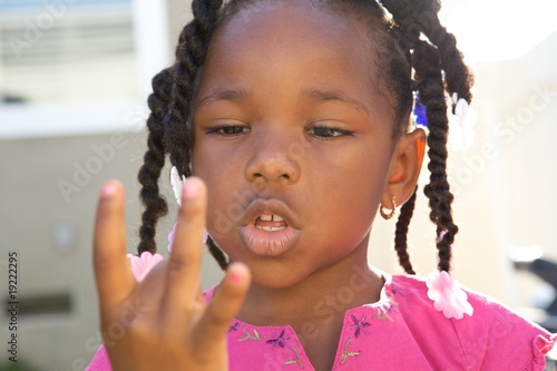 Young Black Girl counting with her fingers
