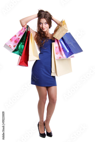 Shopping woman smiling. Isolated over white background