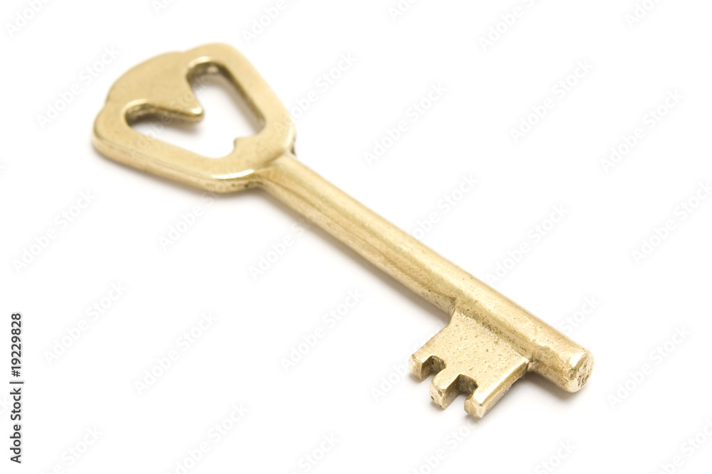 One golden and old key isolated on white background One golden and old key isolated on white background
