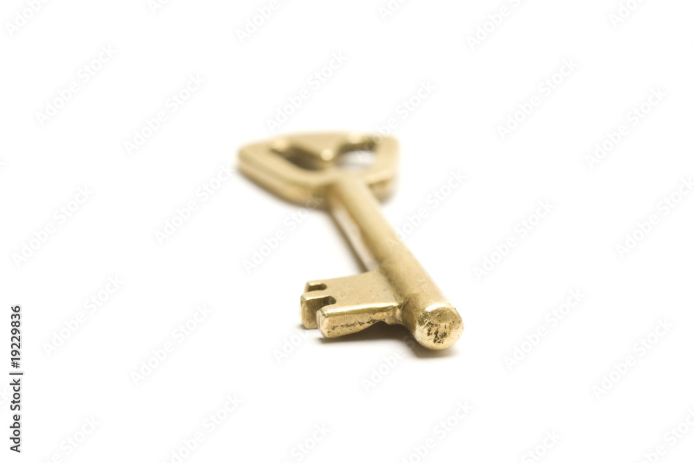 One golden and old key isolated on white background One golden and old key isolated on white background