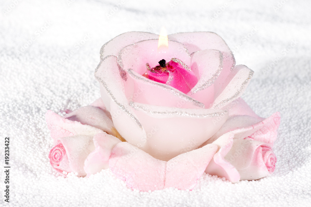 Burning candle in the form of roses. Burning candle in the form of roses.