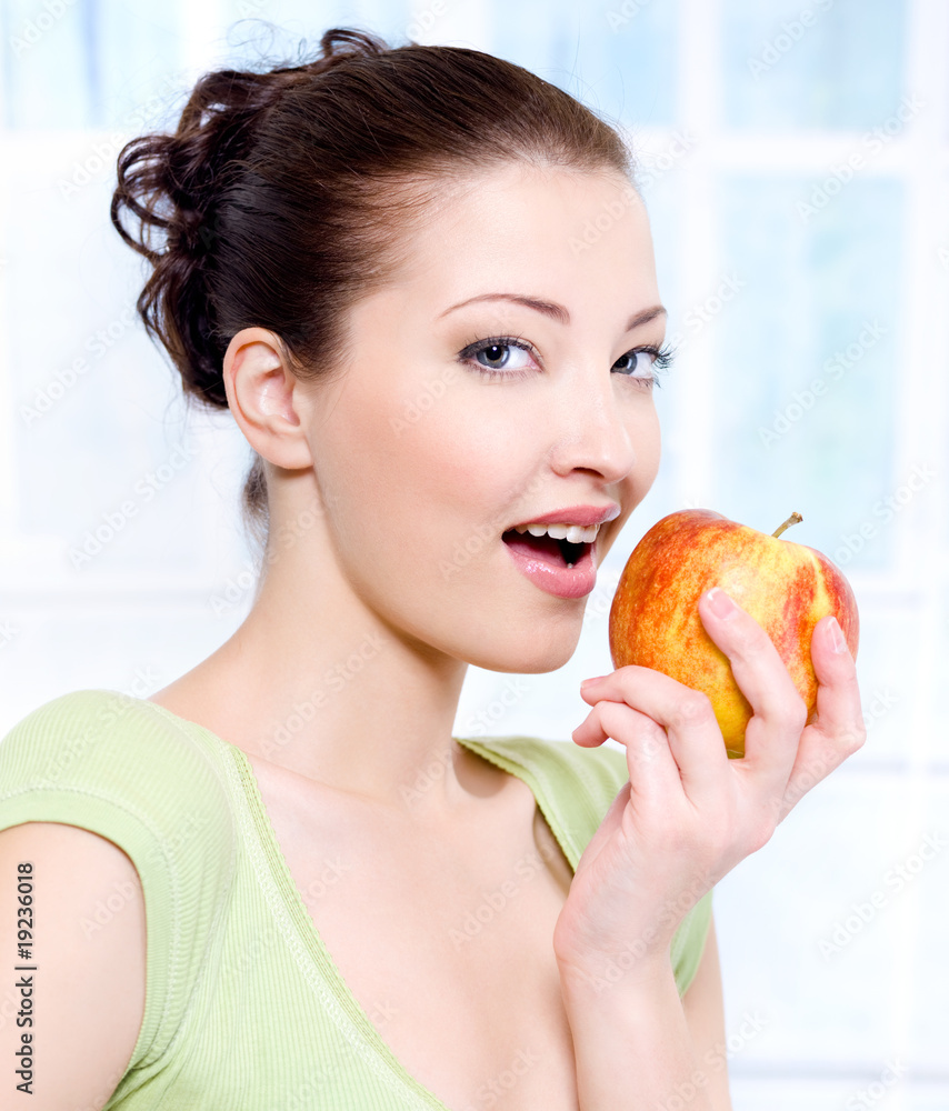 Young beautiful sensulity woman eating apple - indoors Young beautiful sensulity woman eating apple - indoors