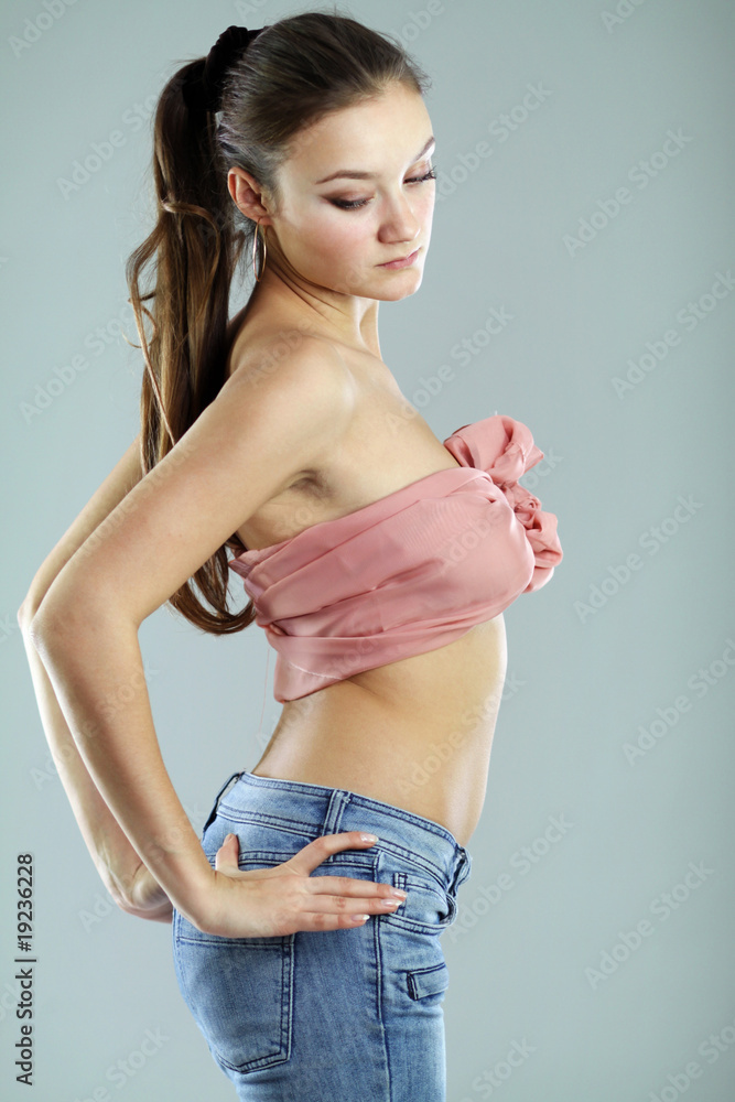 Naklejka premium topless girl in a blue jeans