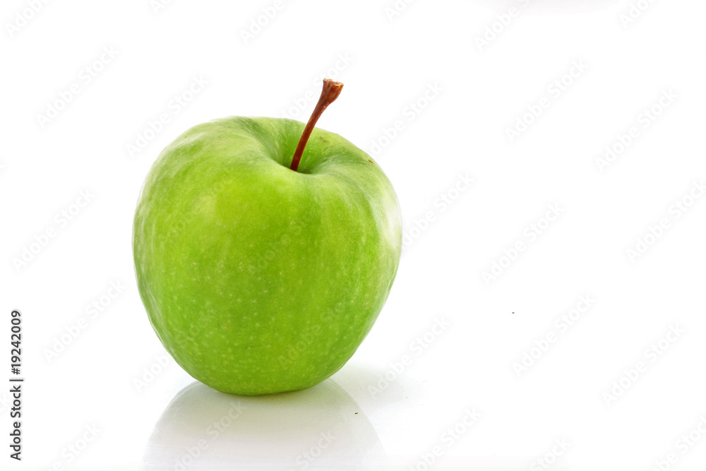 wet green apple covered with  water drops on white background.