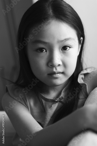black and white portrait of an eight-year old asian girl