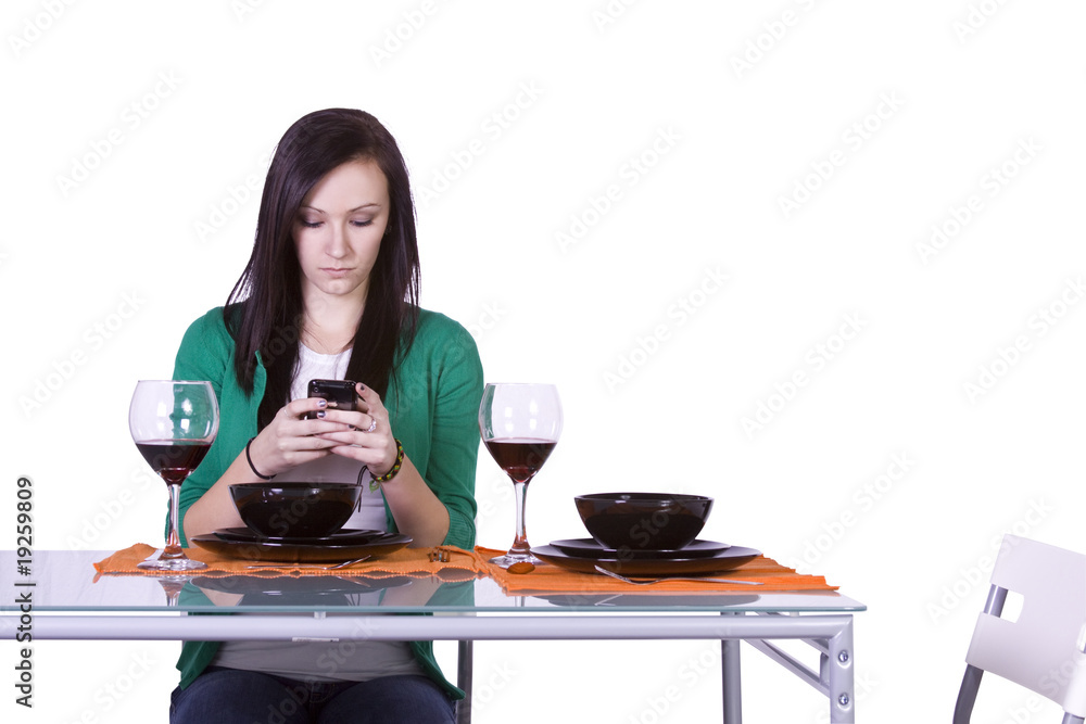Beautiful Woman Texting at the Table Beautiful Woman Texting at the Table
