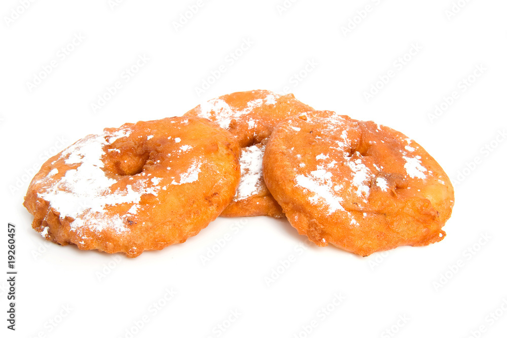 three home bakes apple fritter over white background