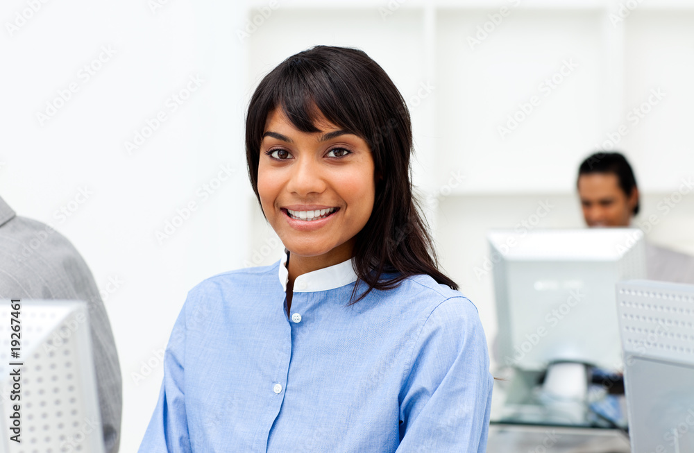 Attractive ethnic businesswoman working at a computer Attractive ethnic businesswoman working at a computer