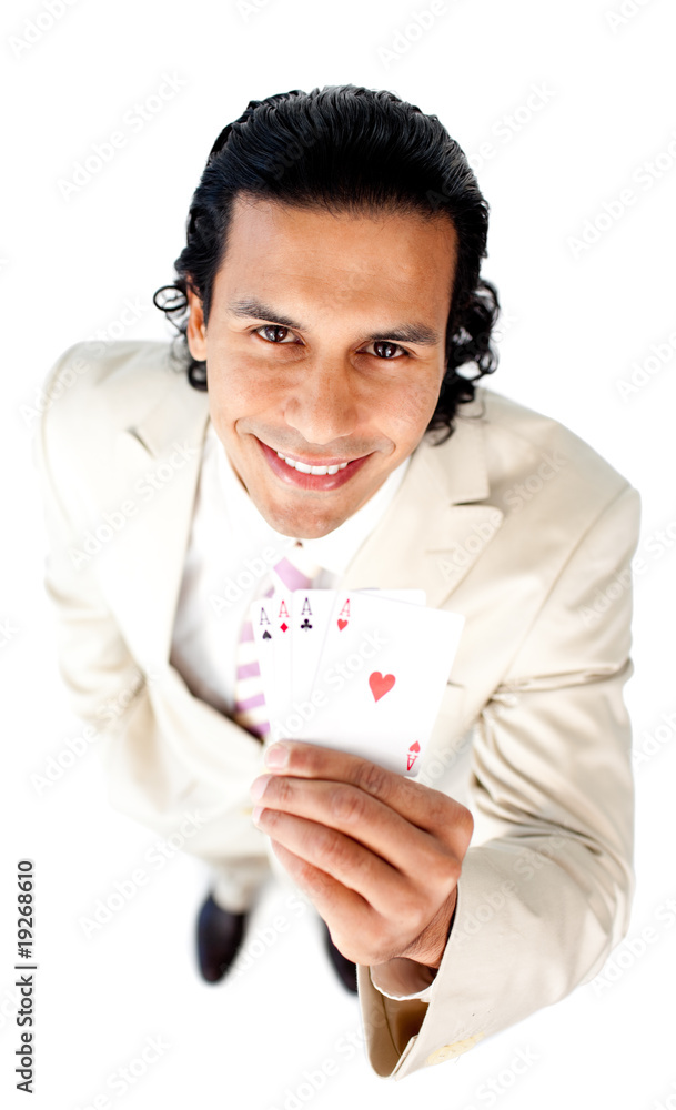 Charming businessman showing a successful hand of cards Charming businessman showing a successful hand of cards