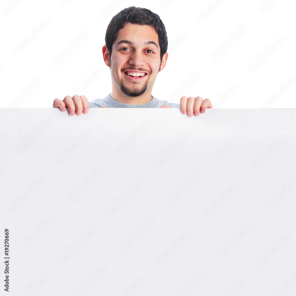 Smiling young man behind large poster board sign Smiling young man behind large poster board sign