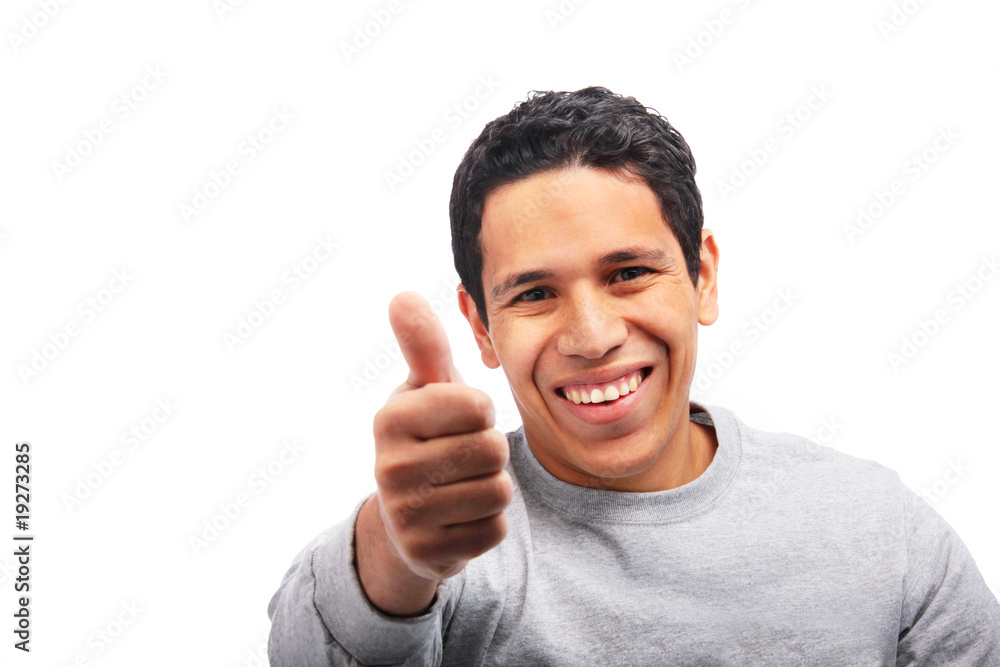 Hispanic young man giving thumbs up Hispanic young man giving thumbs up