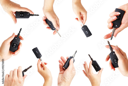 collection Keys from the car in a female hand. It is isolated