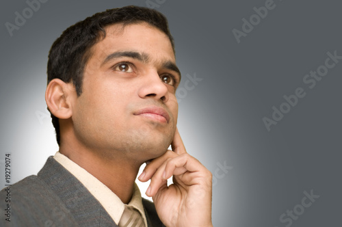 Young businessman thinking