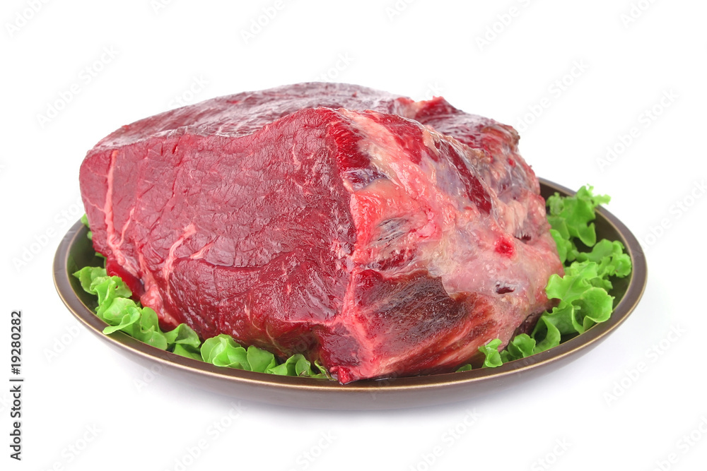 huge uncooked meat on plate huge uncooked meat on plate