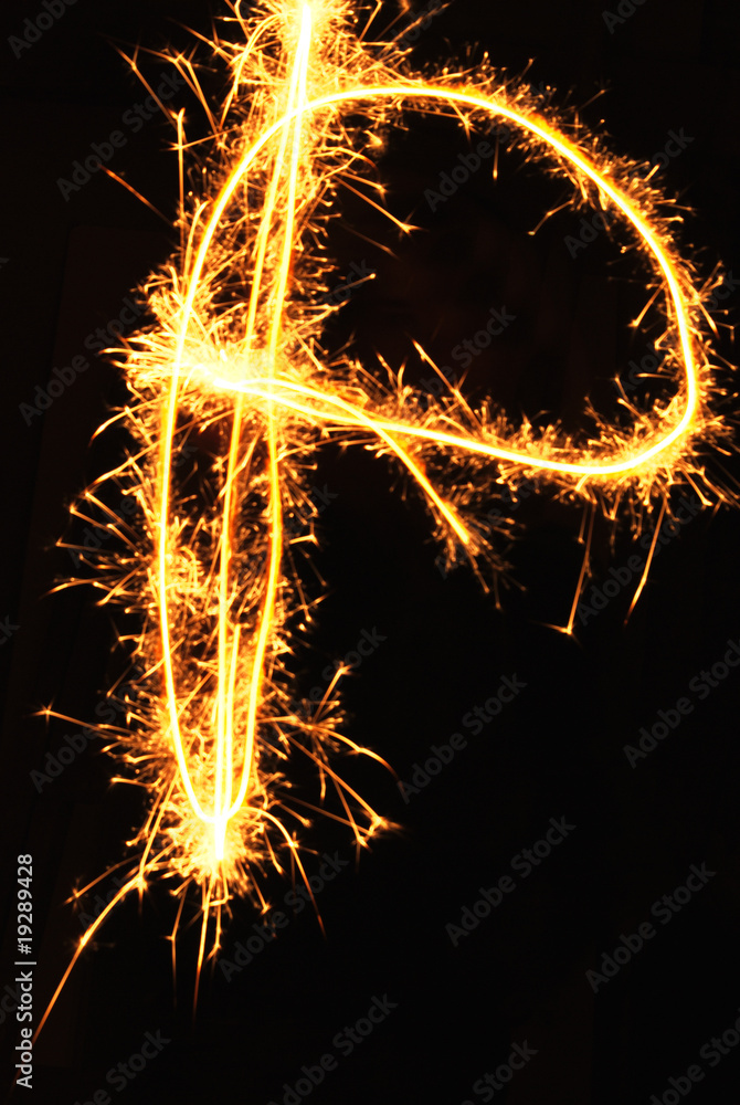 Letter P made of sparklers isolated on black
