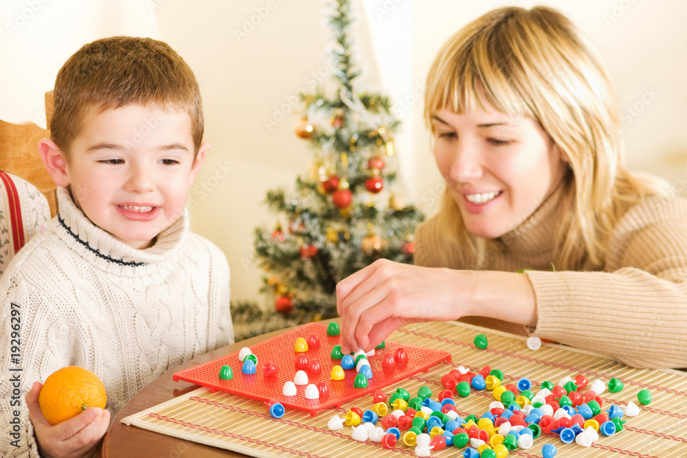 Fototapeta premium Beautiful young boy enjoying his game
