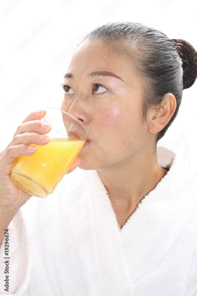 Chinese girl girl drinking orange juice Chinese girl girl drinking orange juice