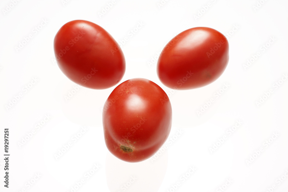 Fresh roma tomatoes isolated on white. Fresh roma tomatoes isolated on white.