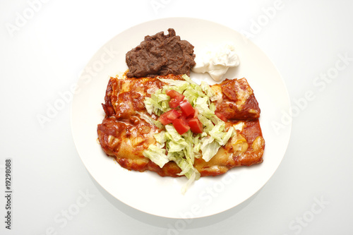 Plate of enchiladas and refried beans