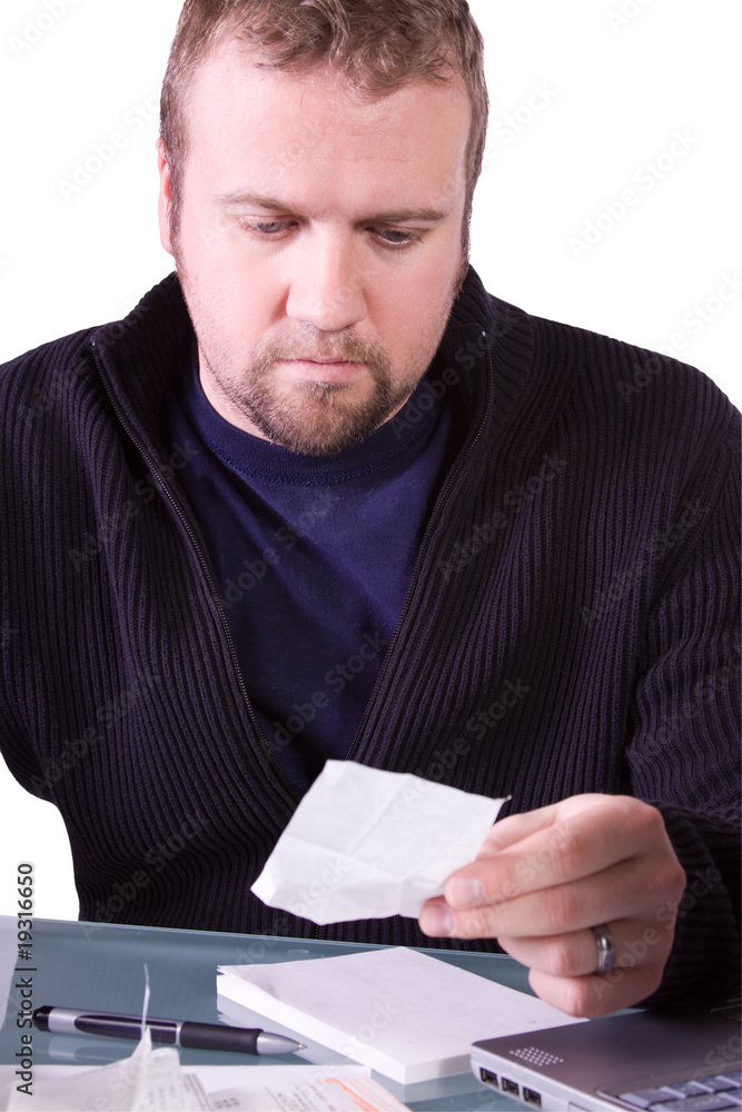 Young Casual Businessman Working at his Desk Young Casual Businessman Working at his Desk