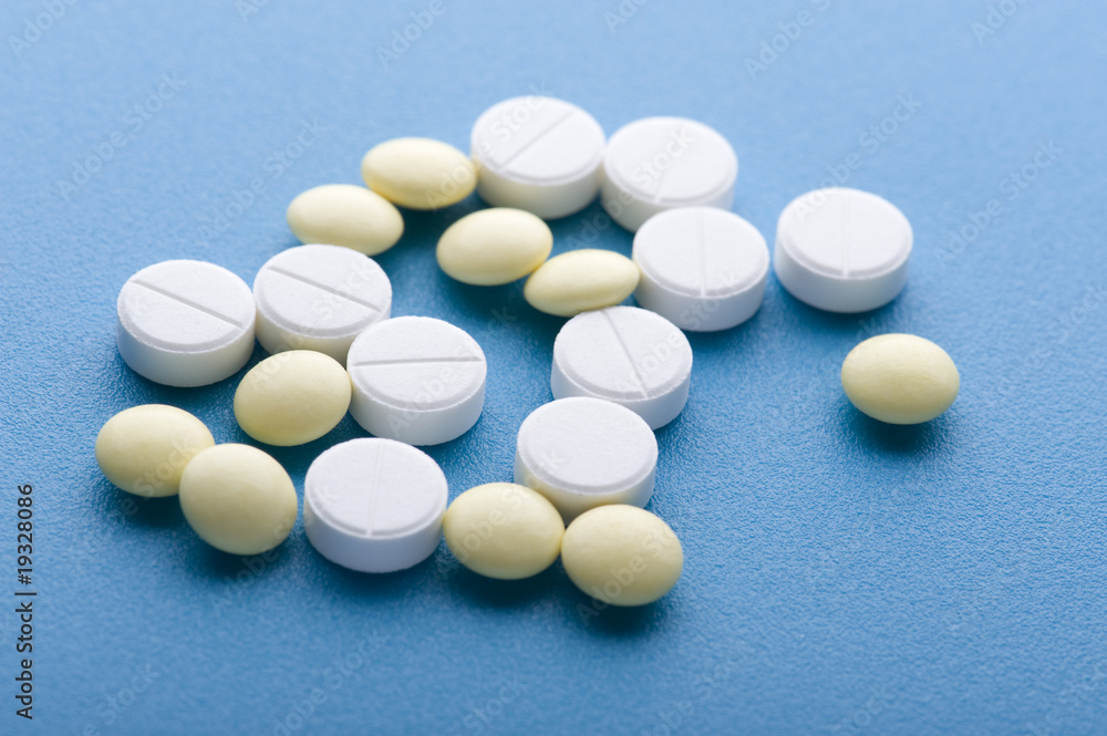 Tablets on blue macro Tablets on blue macro