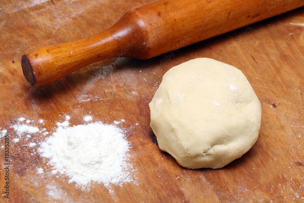 rolling-pin with pastry rolling-pin with pastry