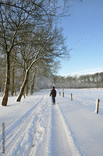 Senior woman walking in a winter wonder land