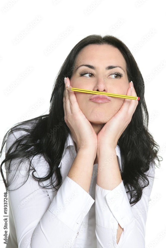 Brunette woman thinking with pencil Brunette woman thinking with pencil