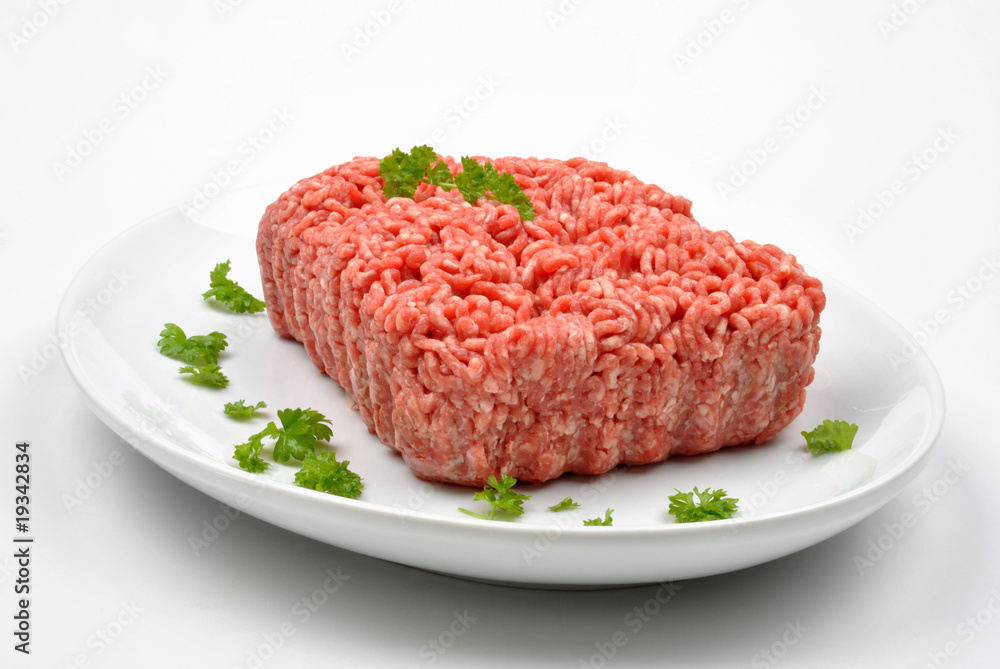 minced meat with parsley on a plate minced meat with parsley on a plate