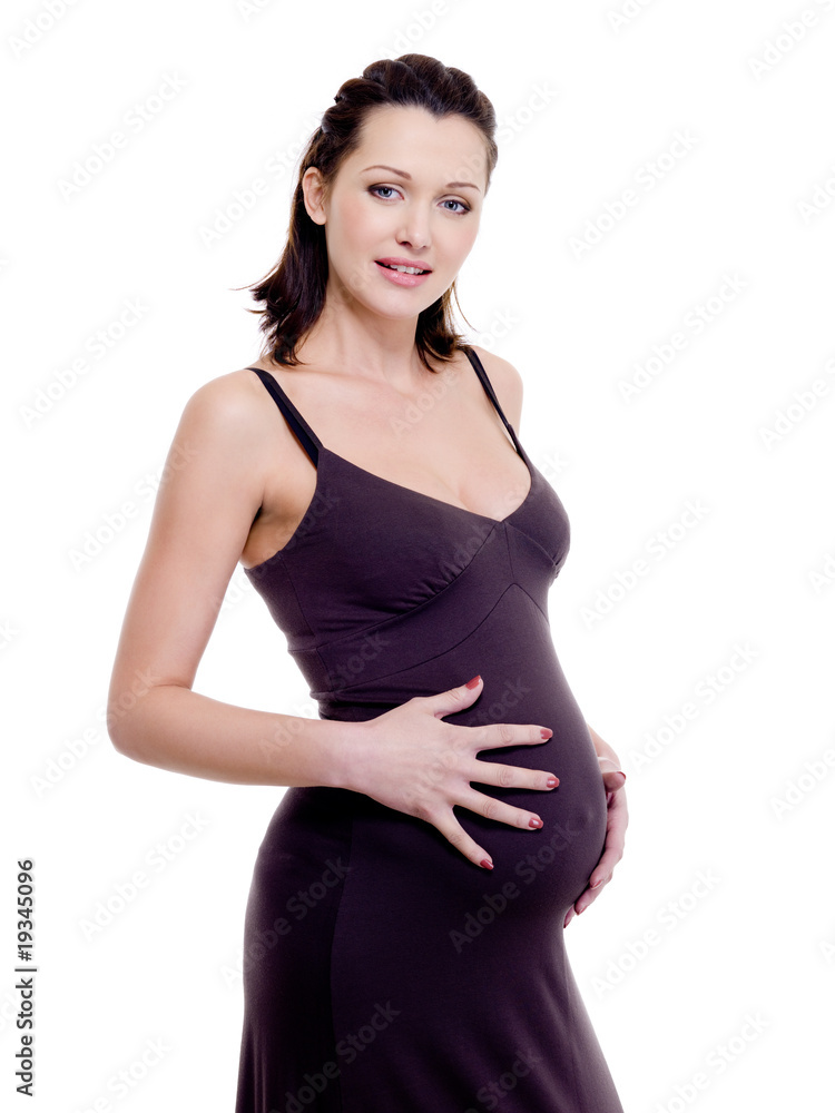 happy attractive pregnant woman touching her tummy happy attractive pregnant woman touching her tummy
