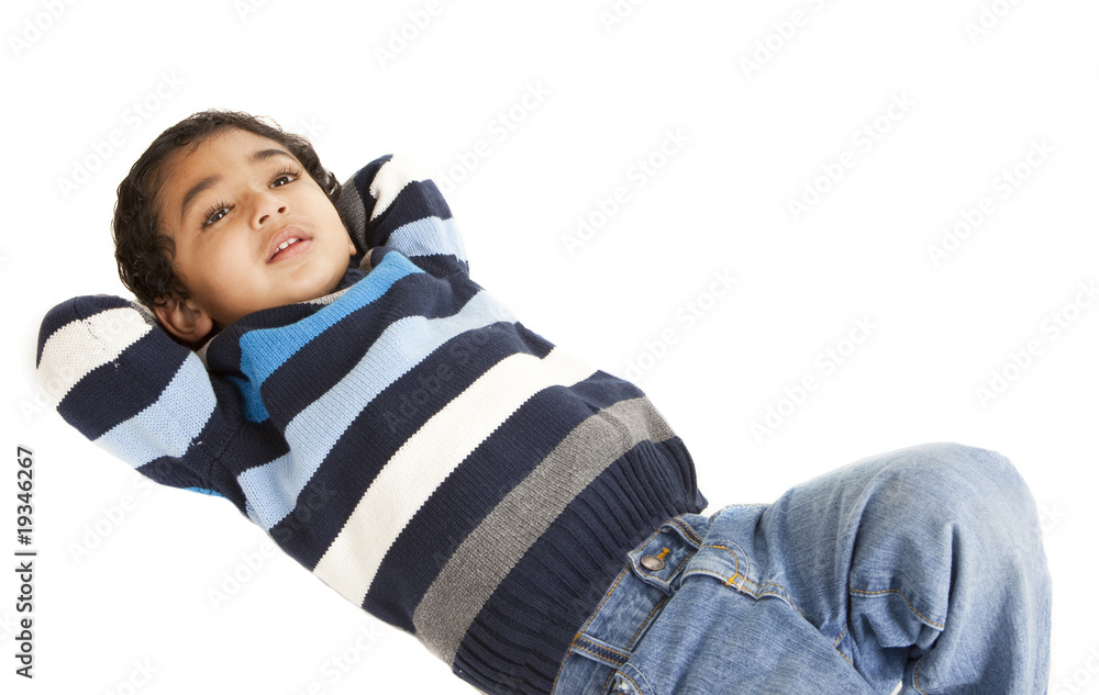 Portrait of a Smiling Toddler Lying on Floor, Isolated, White Portrait of a Smiling Toddler Lying on Floor, Isolated, White