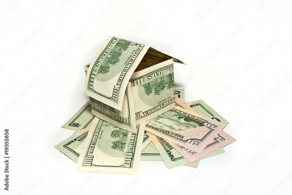House made from hundred dollar bills on white background House made from hundred dollar bills on white background