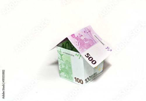 House made from euro bills on white background