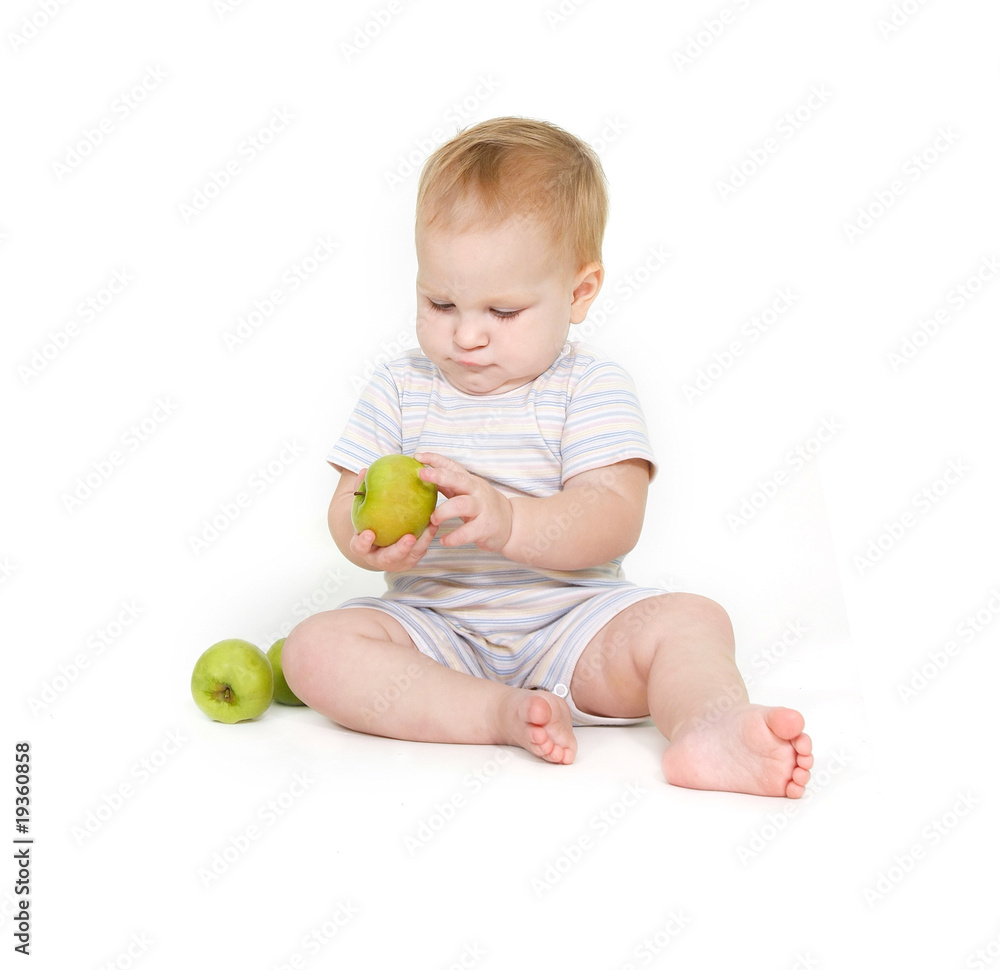 cute toddler with apples over white cute toddler with apples over white