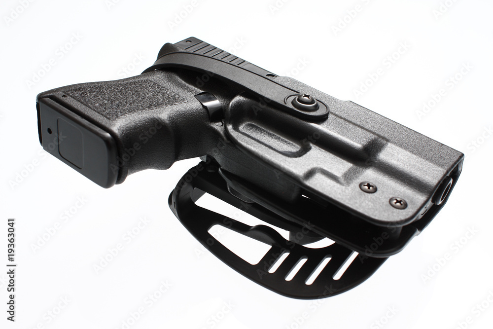 A pistol in a hard case holster