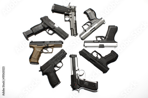 Circle of assorted pistols