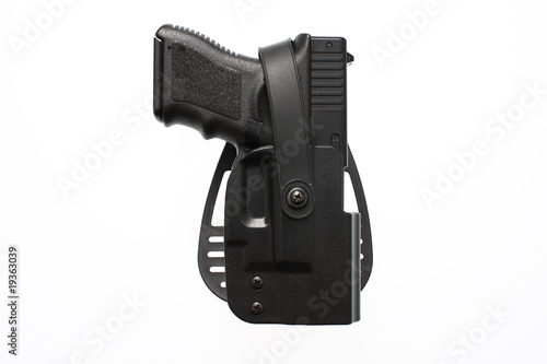 A pistol in a hard case holster
