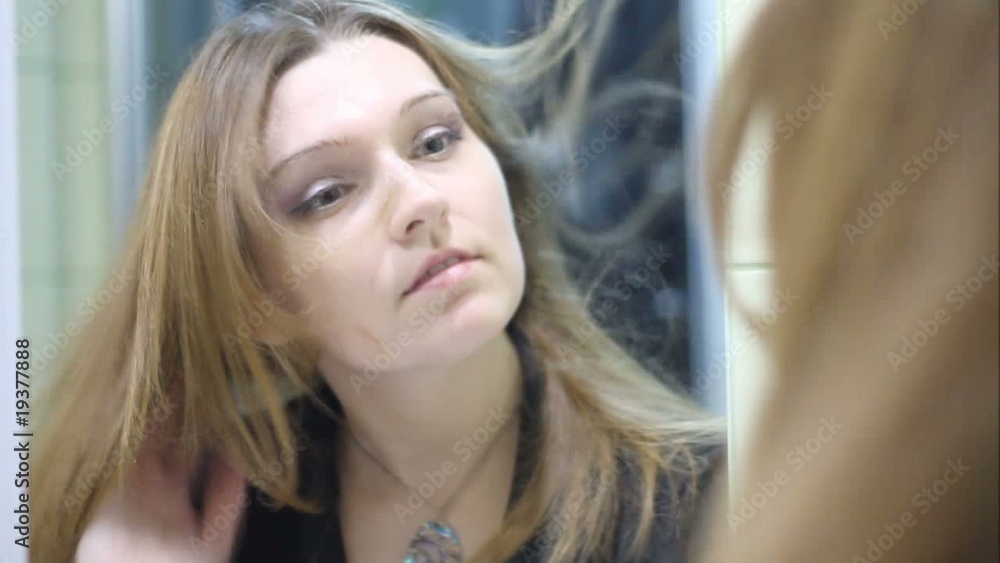 Beautiful woman drying her hair (slow motion) Beautiful woman drying her hair (slow motion)