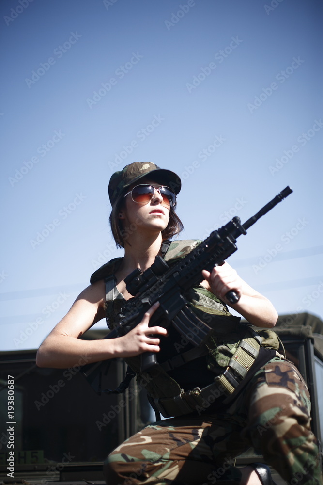 Military woman with rifle Military woman with rifle