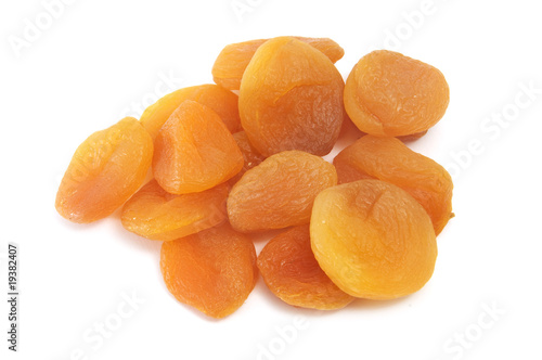 a dried peaches on a white background