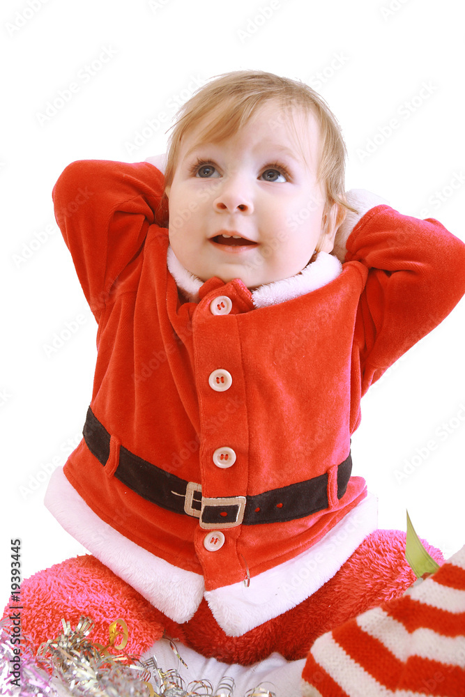 Little happy girl in red santa's clothes