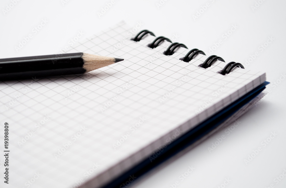 notebook with black pencil notebook with black pencil