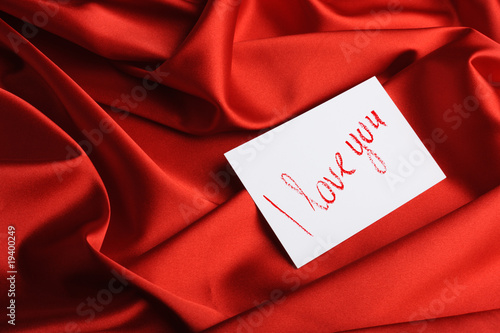 Note on red silk. With an inscription " I love you ". Drawn by
