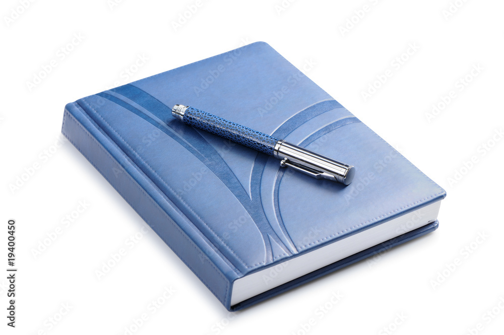 Pen and a closed notebook Pen and a closed notebook