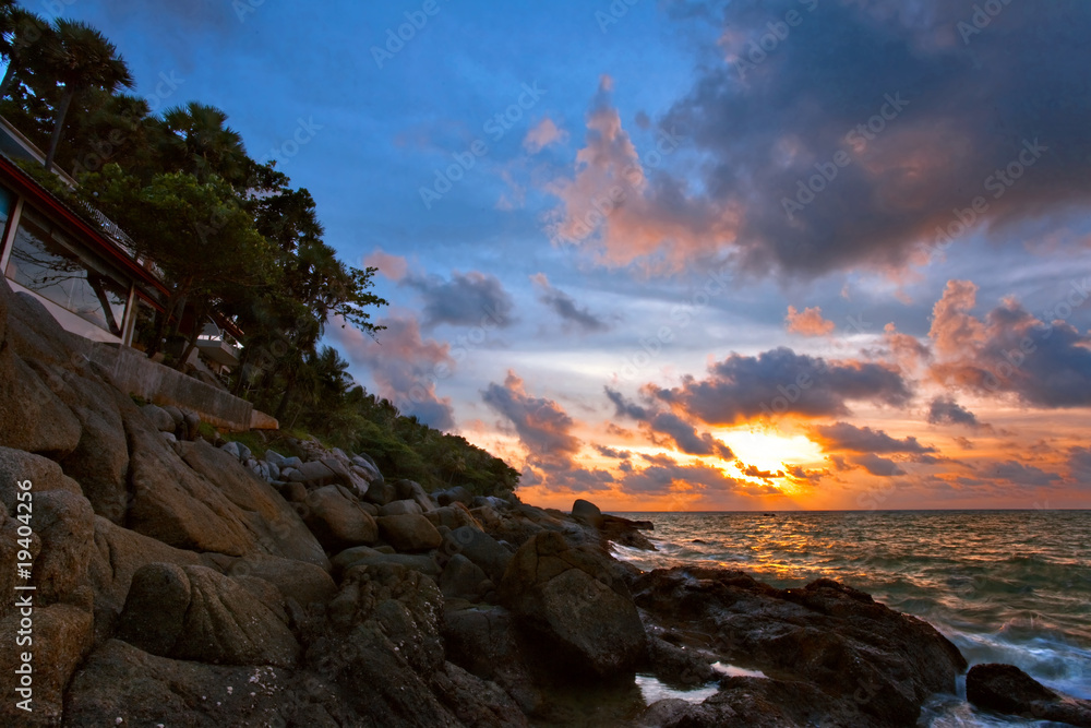 Tropical sunset on the beach. Phuket island. Thailand