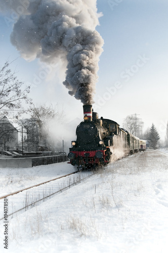 Old steam locomotive in the snow